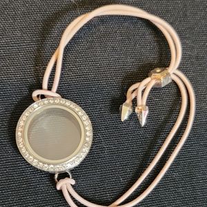 Origami Owl Petite Twist Living Locket on pink stretch bracelet.